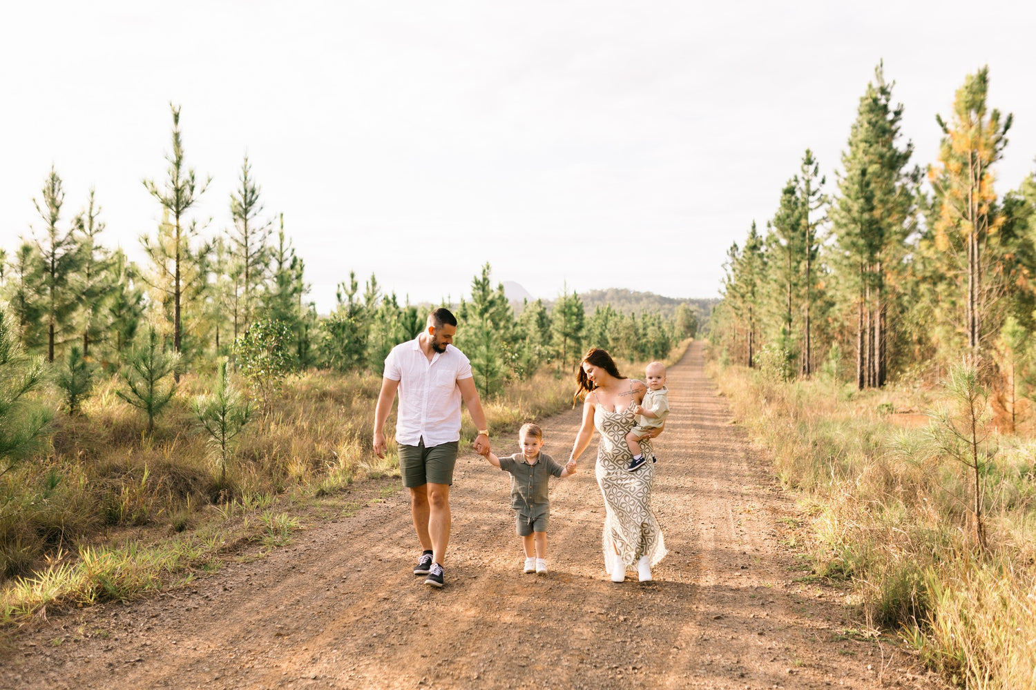 Family walking down a dirt path