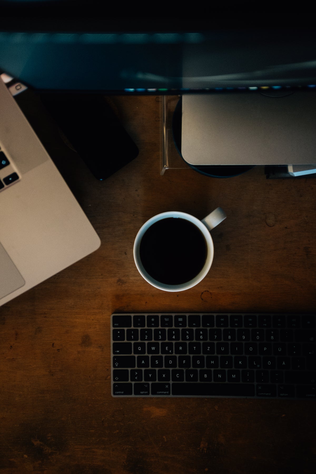 Cup of black coffee sitting on the office desk