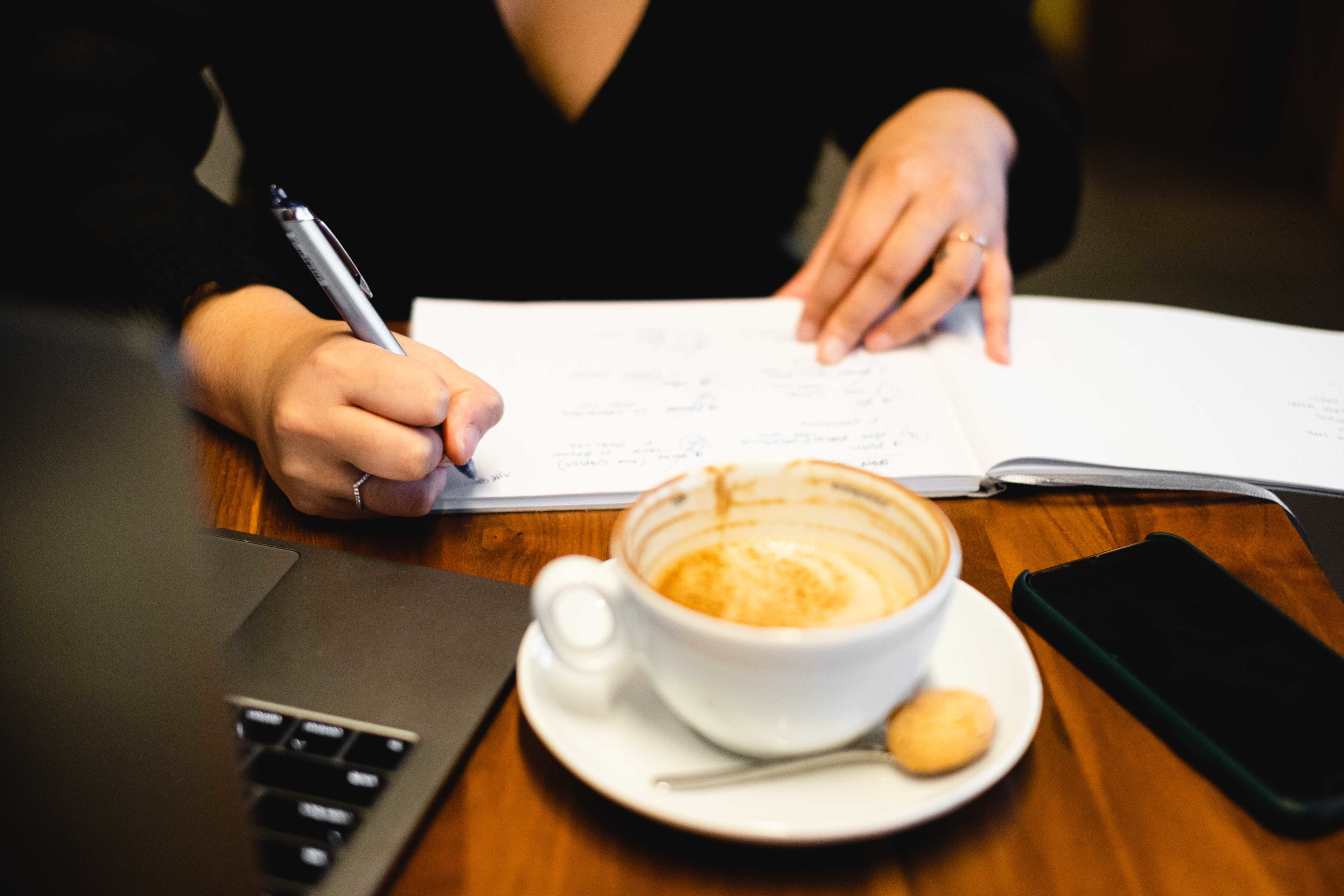 Half a cup of specialty coffee sitting on the office desk